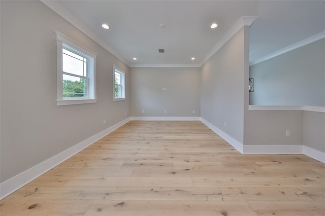 spare room with light hardwood / wood-style floors and ornamental molding