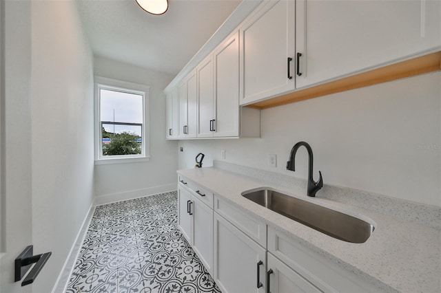 washroom with light tile patterned floors and sink