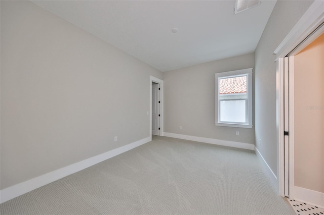 unfurnished bedroom with light colored carpet