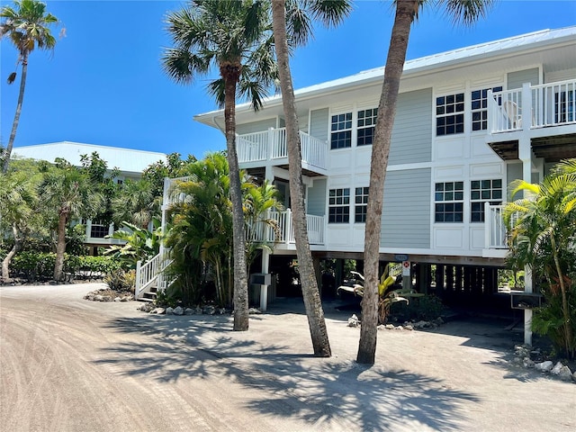 rear view of property with a balcony