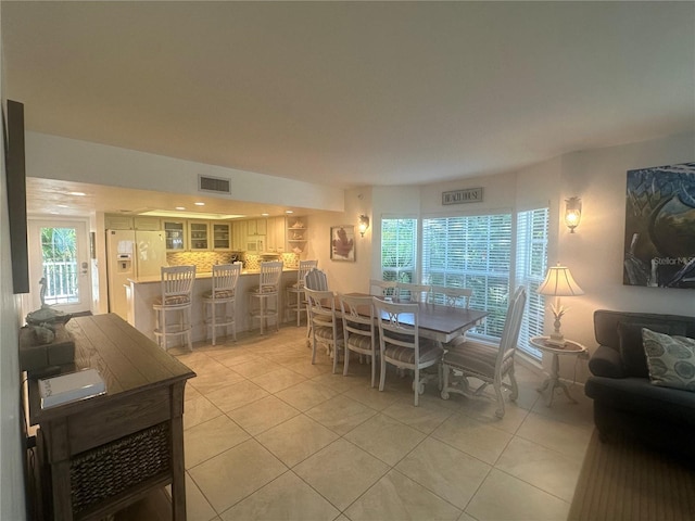 dining area featuring light tile patterned floors