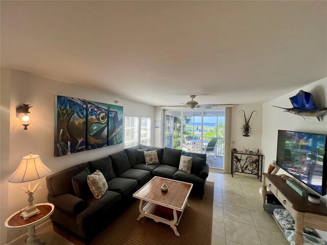 tiled living room with ceiling fan