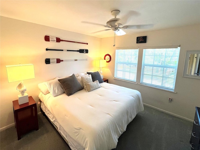 bedroom with ceiling fan and dark carpet