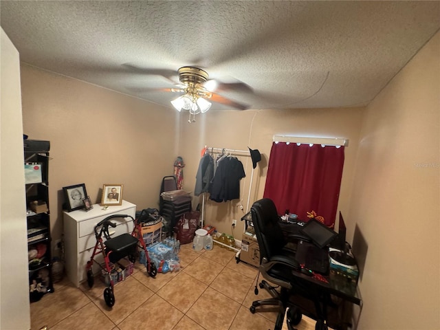 office with ceiling fan, light tile patterned flooring, and a textured ceiling