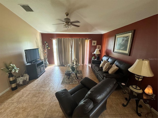 tiled living room featuring ceiling fan