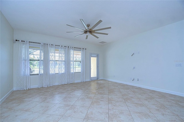 unfurnished room with light tile patterned floors and ceiling fan