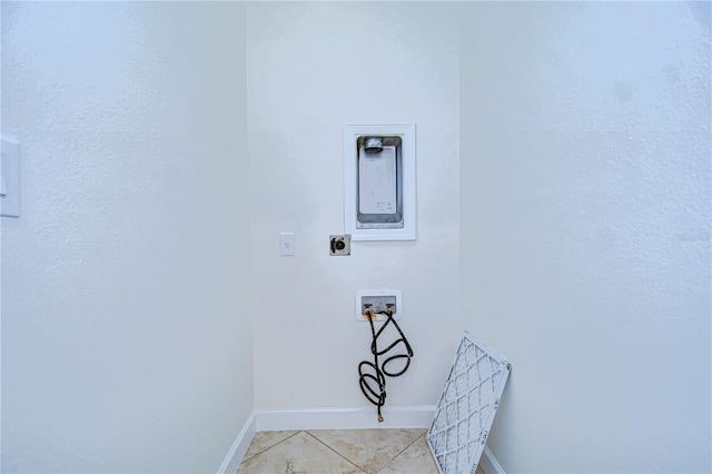 clothes washing area with washer hookup, light tile patterned floors, and electric dryer hookup