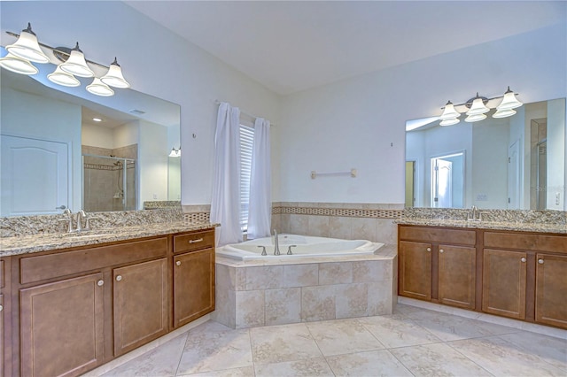 bathroom featuring vanity, shower with separate bathtub, and tile patterned flooring