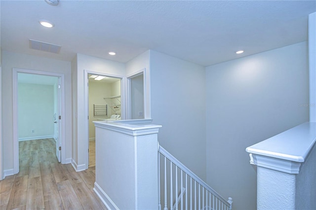 hallway featuring light hardwood / wood-style flooring