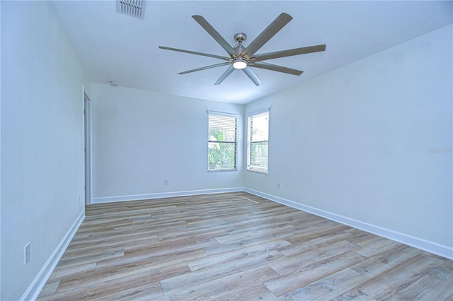 unfurnished room featuring light hardwood / wood-style floors and ceiling fan