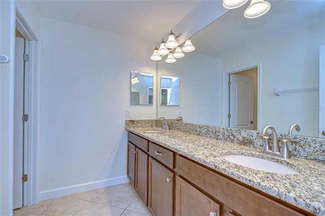 bathroom with tile patterned floors and vanity