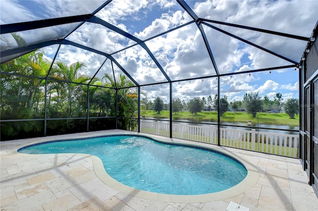 view of pool with a lanai, a patio, and a water view