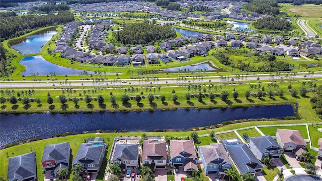 birds eye view of property with a water view