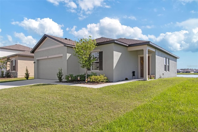 view of front of property with a water view, a garage, and a front lawn