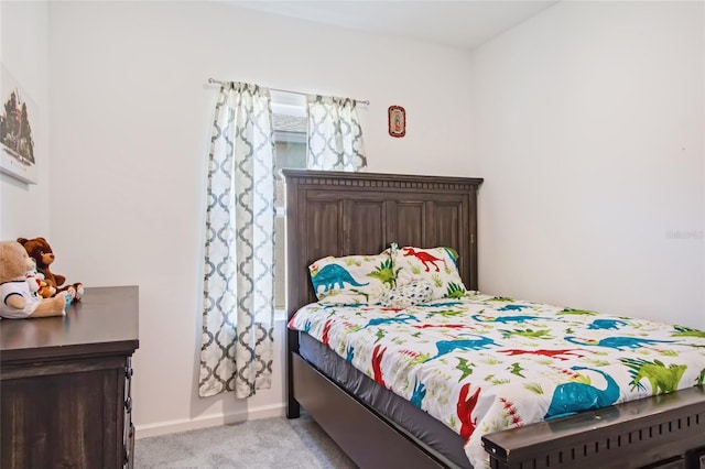 bedroom featuring light colored carpet