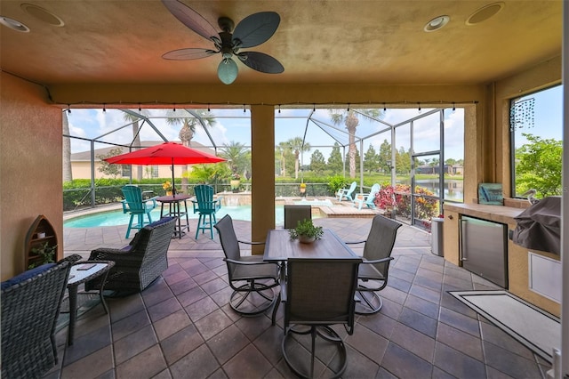 view of patio / terrace with glass enclosure and ceiling fan