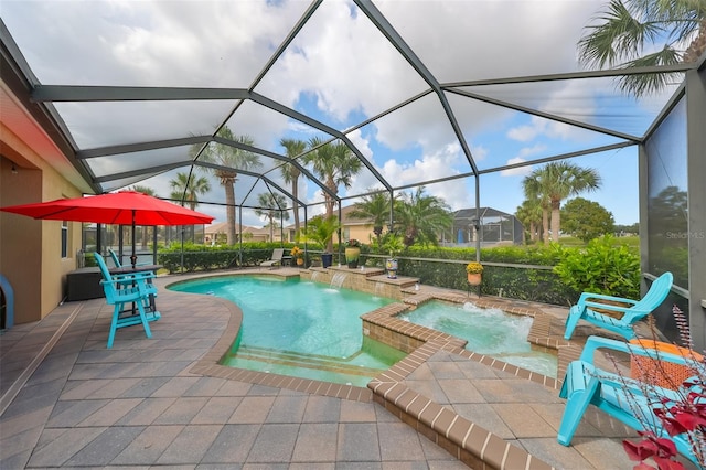 view of pool with pool water feature, glass enclosure, an in ground hot tub, and a patio