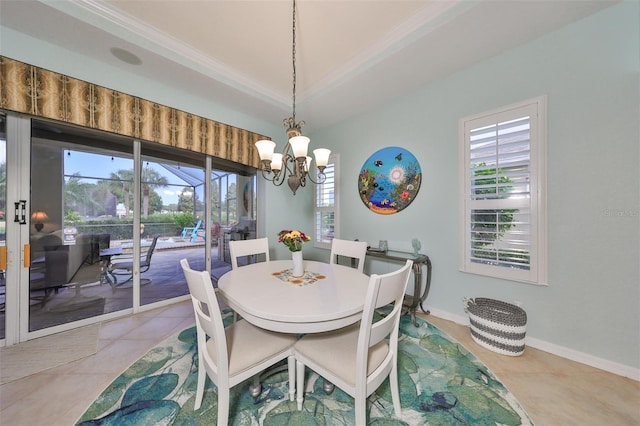 dining area with a notable chandelier, a healthy amount of sunlight, light tile patterned floors, and ornamental molding