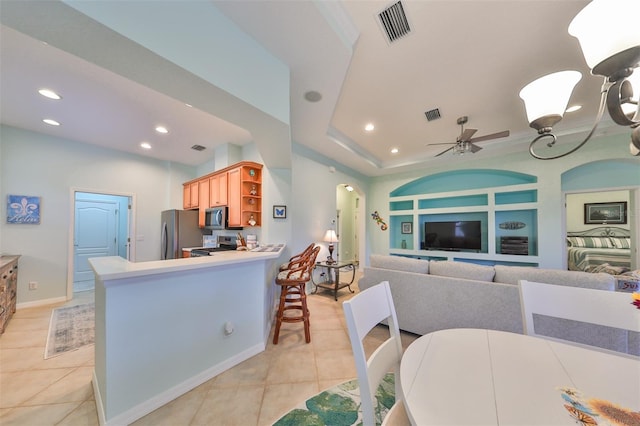 interior space featuring ceiling fan and light tile patterned floors