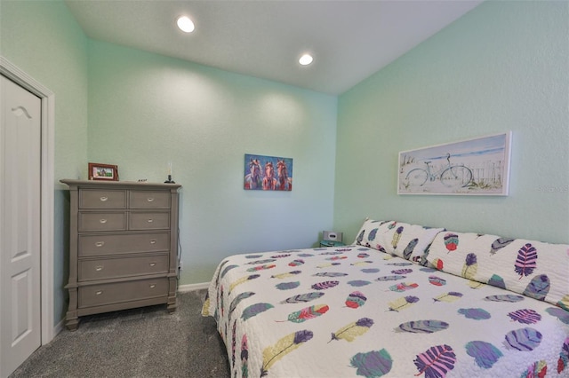 carpeted bedroom with lofted ceiling