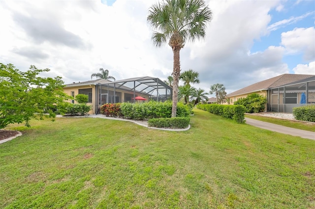 view of yard featuring a lanai