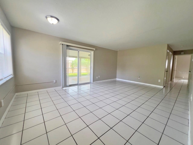 unfurnished room featuring light tile patterned floors