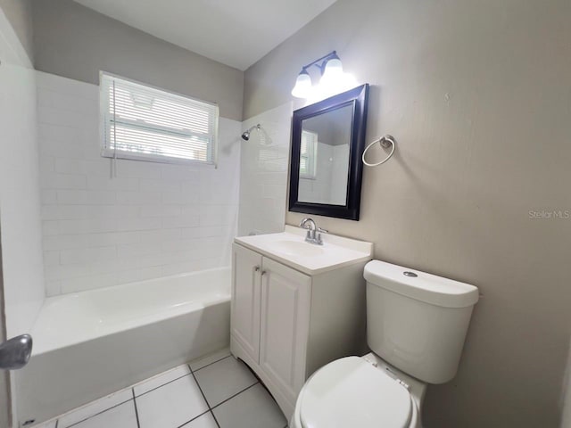 full bathroom with tiled shower / bath, vanity, tile patterned flooring, and toilet