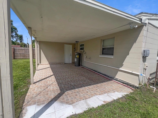 view of patio featuring electric water heater