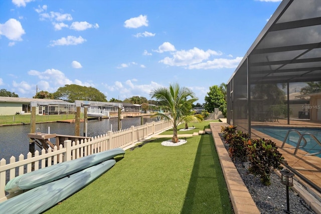 view of yard featuring a water view, a fenced in pool, a lanai, and a dock