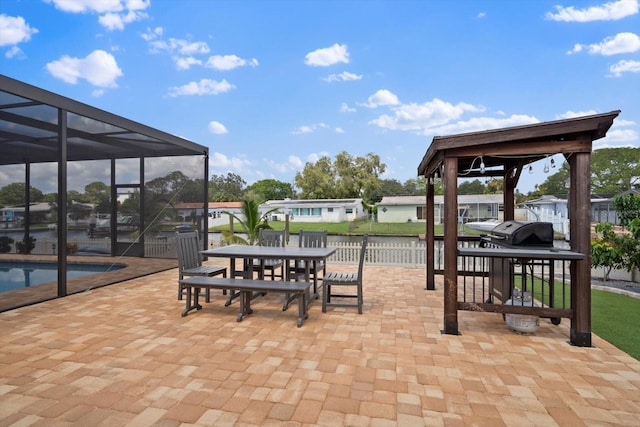 view of patio with glass enclosure