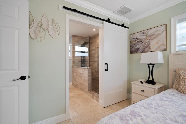 bedroom featuring ornamental molding and a barn door