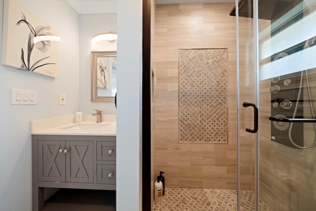 bathroom with walk in shower and vanity