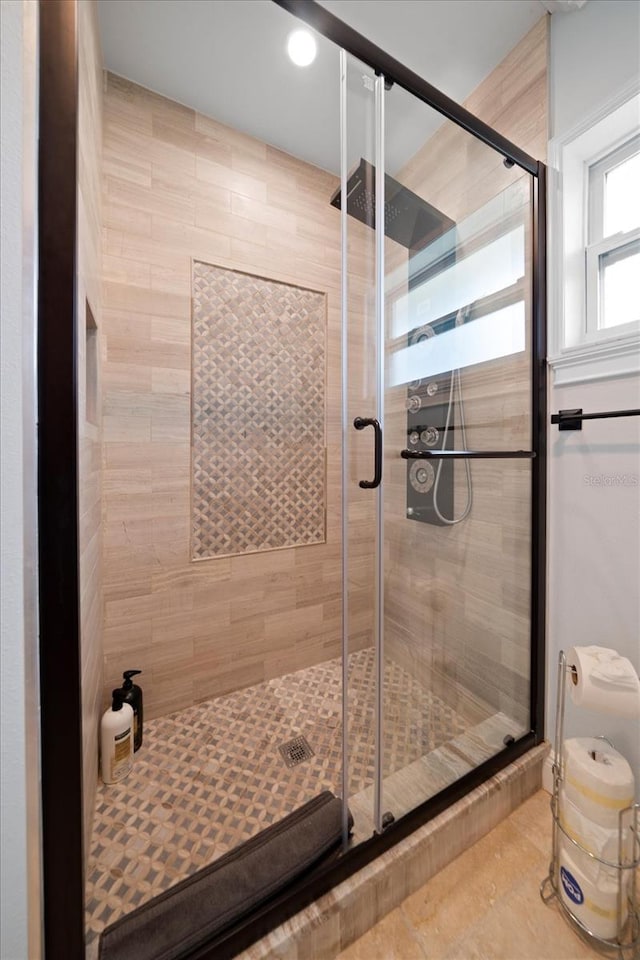 bathroom featuring an enclosed shower