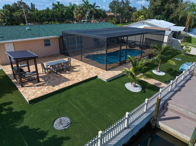 view of pool featuring a patio area and a yard