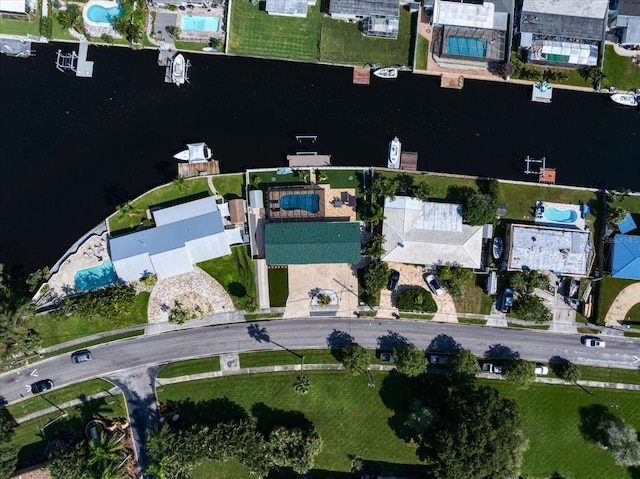 birds eye view of property with a water view