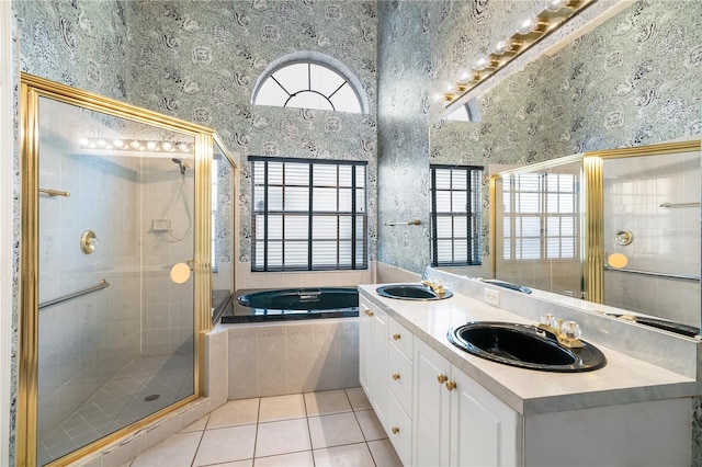 bathroom with tile patterned flooring, vanity, and independent shower and bath