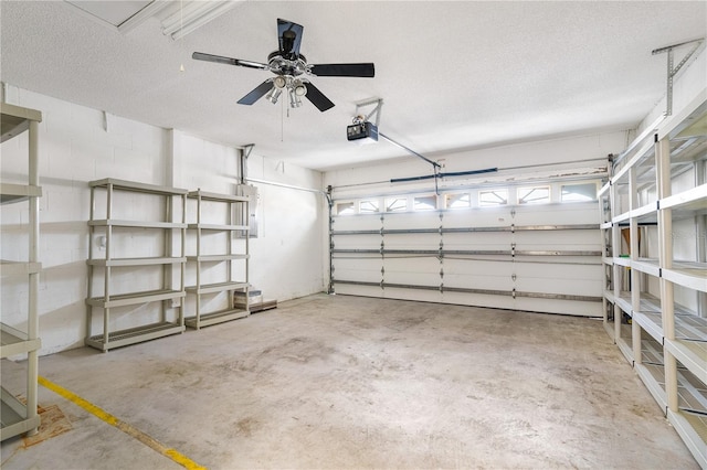 garage featuring ceiling fan and a garage door opener