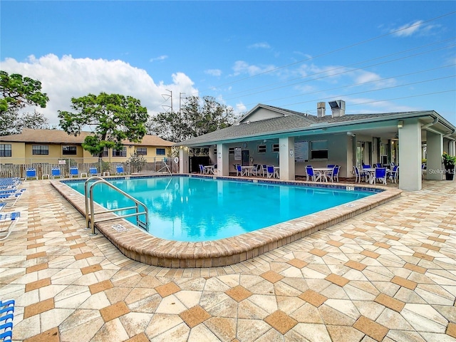 view of swimming pool featuring a patio area