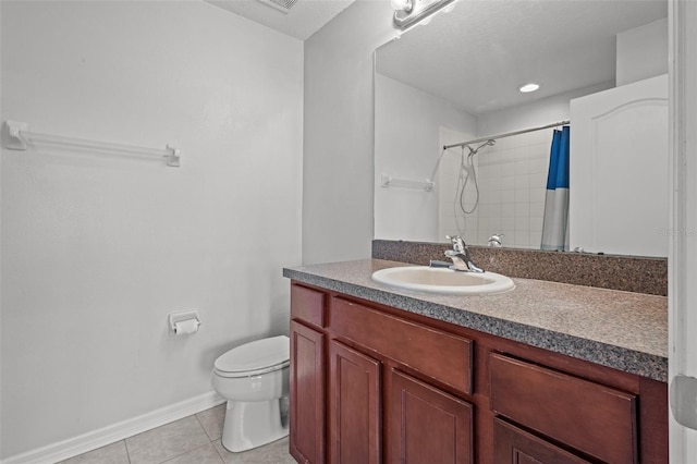 bathroom with curtained shower, vanity, a textured ceiling, toilet, and tile patterned floors