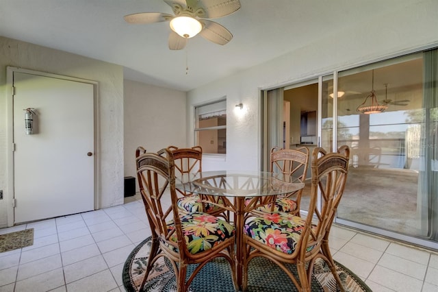 dining room featuring ceiling fan and light tile patterned flooring