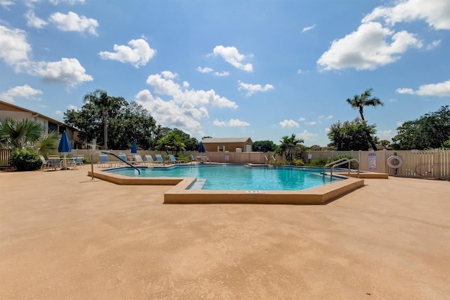 view of swimming pool featuring a patio area