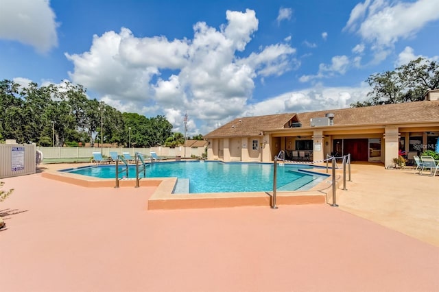 view of swimming pool with a patio area