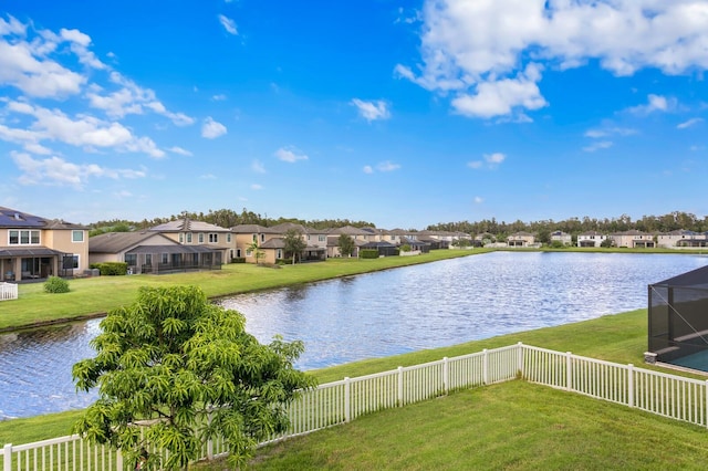 water view with fence and a residential view