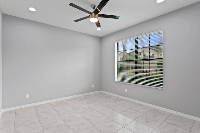 spare room with recessed lighting, baseboards, and ceiling fan