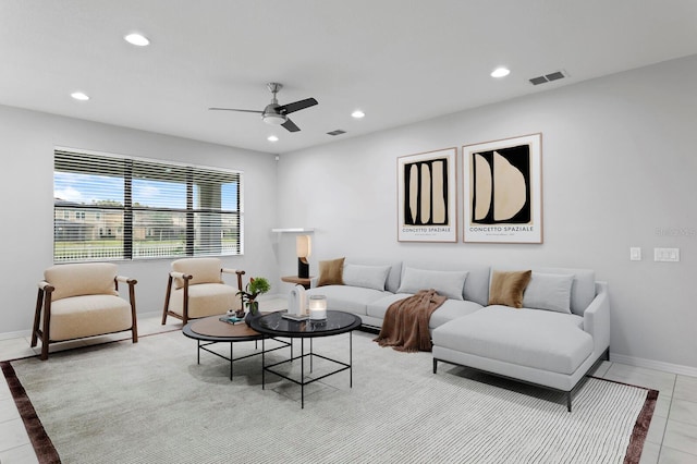 tiled living room featuring ceiling fan