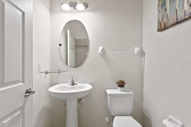 half bathroom with toilet