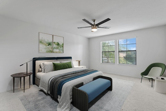 carpeted bedroom with a ceiling fan