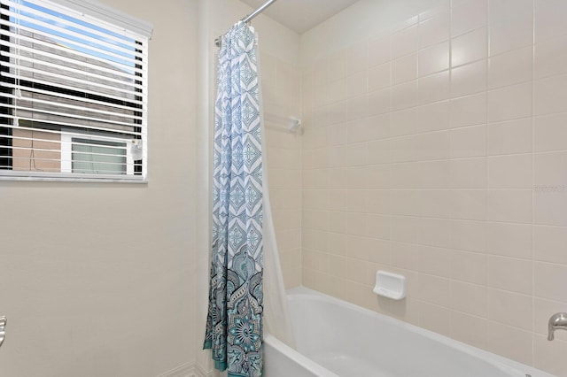 bathroom featuring shower / bath combination with curtain
