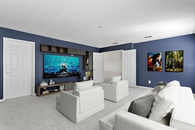 carpeted cinema with baseboards and visible vents
