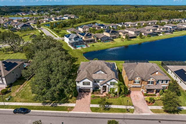 birds eye view of property featuring a residential view and a water view
